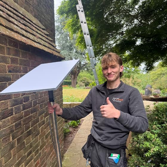 Berkshire WiFi engineer with a Starlink dish after installation