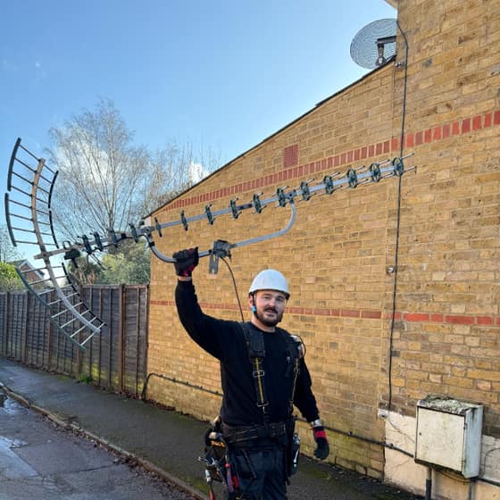Berkshire WiFi engineer holding a TV aerial after removal